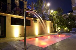 Seasonal outdoor pool, open 8:30 AM to 8:00 PM, pool umbrellas