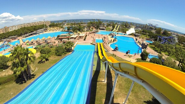 A water park with multiple slides and pools. - MALDIVAS Apartments (La Pineda)