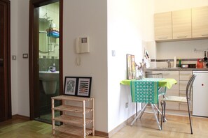 Family Studio, City View | Private kitchen | Fridge, stovetop, electric kettle, cookware/dishes/utensils - Studio 22 Rozino (Budva)