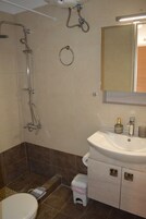 Premium Studio, 1 Bedroom, Kitchen, Sea View | Bathroom | Shower, rainfall showerhead, hair dryer, slippers