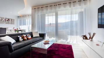 Exclusive Apartment, 2 Bedrooms, Sea View | Living area | 55-inch flat-screen TV with premium TV channels, Smart TV, Netflix