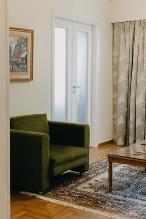 Traditional Apartment, 1 King Bed with Sofa bed, Balcony, City View | Living area | Flat-screen TV