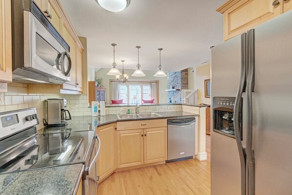 Dishwasher, coffee/tea maker, cookware/dishes/utensils, dining tables