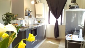 Panoramic Apartment, River View | Private kitchen | Espresso maker, coffee/tea maker, electric kettle, highchair - Bed&Breakfast Santo Stefano (Verona)
