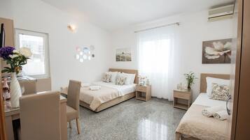 Standard Triple Room, Sea View | Individually decorated, iron/ironing board, free WiFi, bed sheets