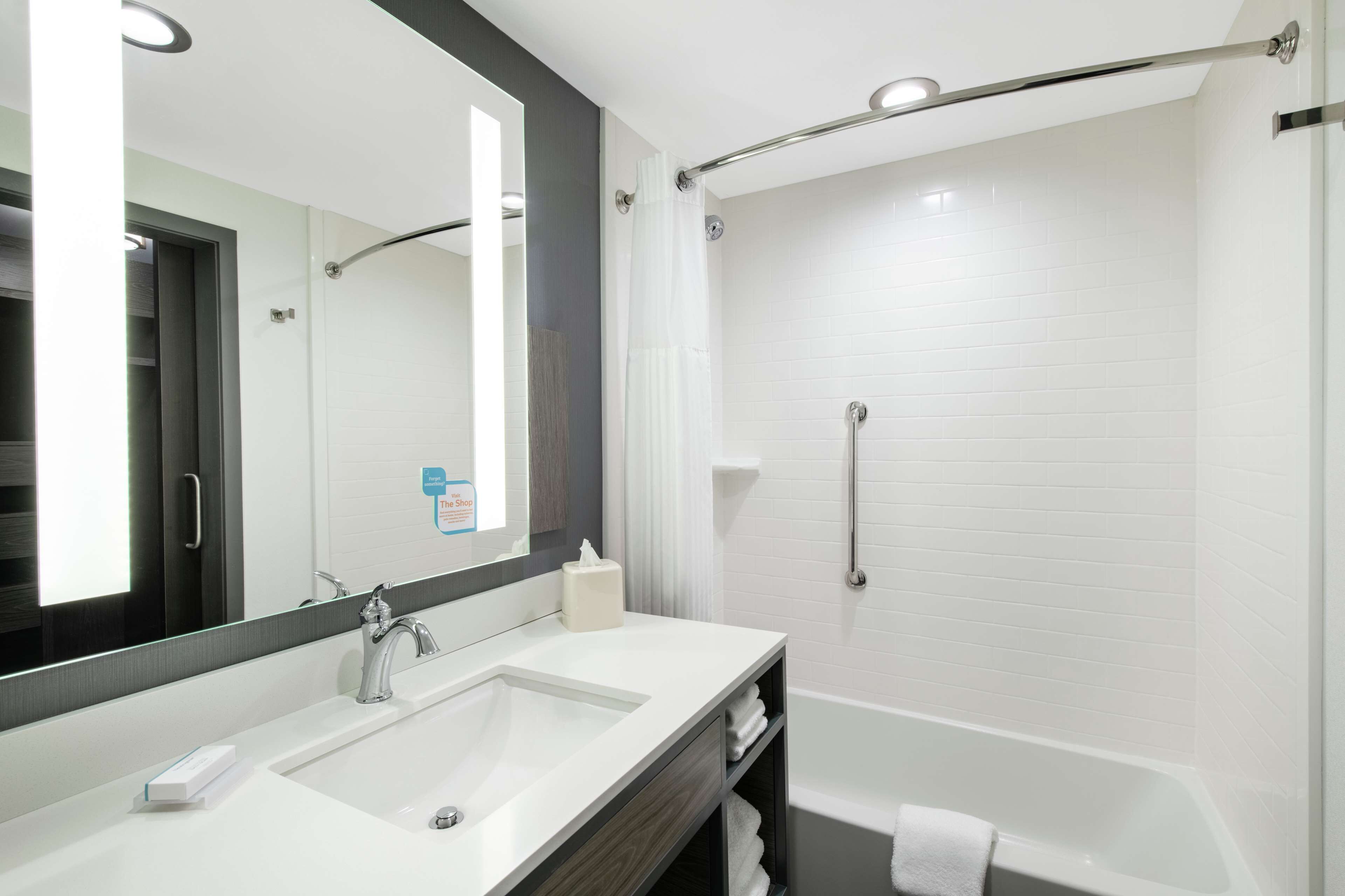 designer toiletries, hair dryer, towels, soap