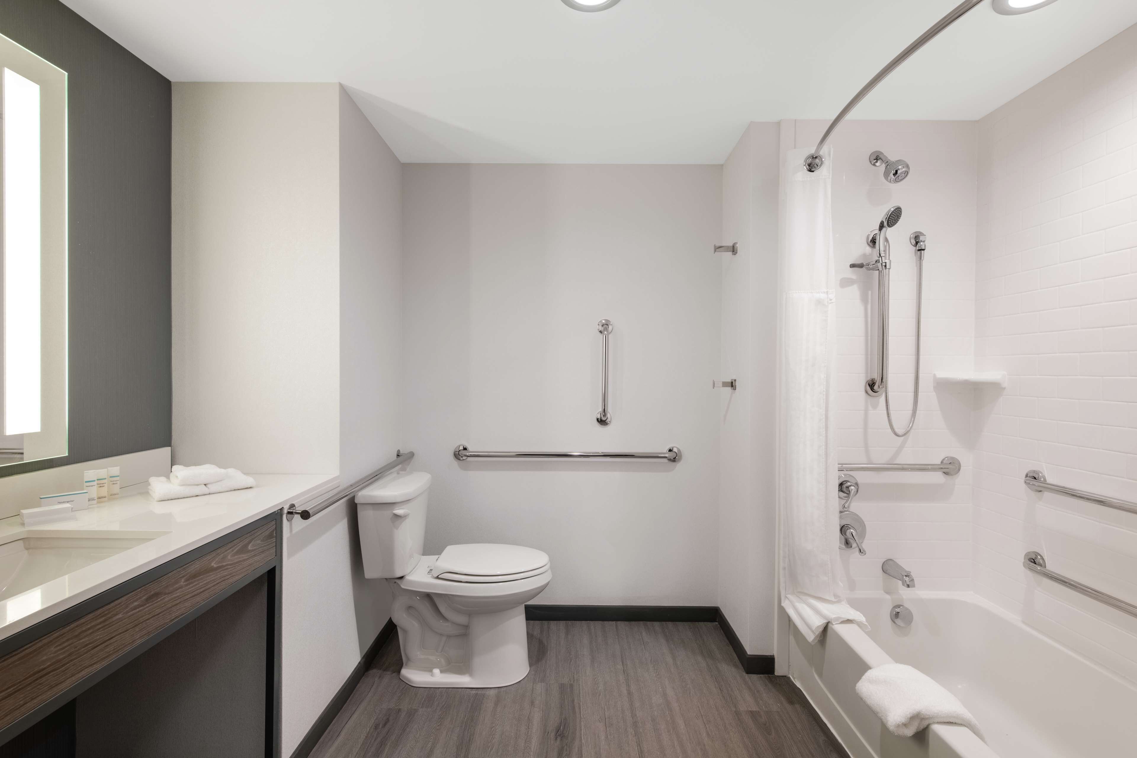 designer toiletries, hair dryer, towels, soap