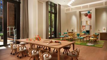Enjoy group activities or meetings around the large table, or relax in the adjacent seating area with a view of the outdoors.