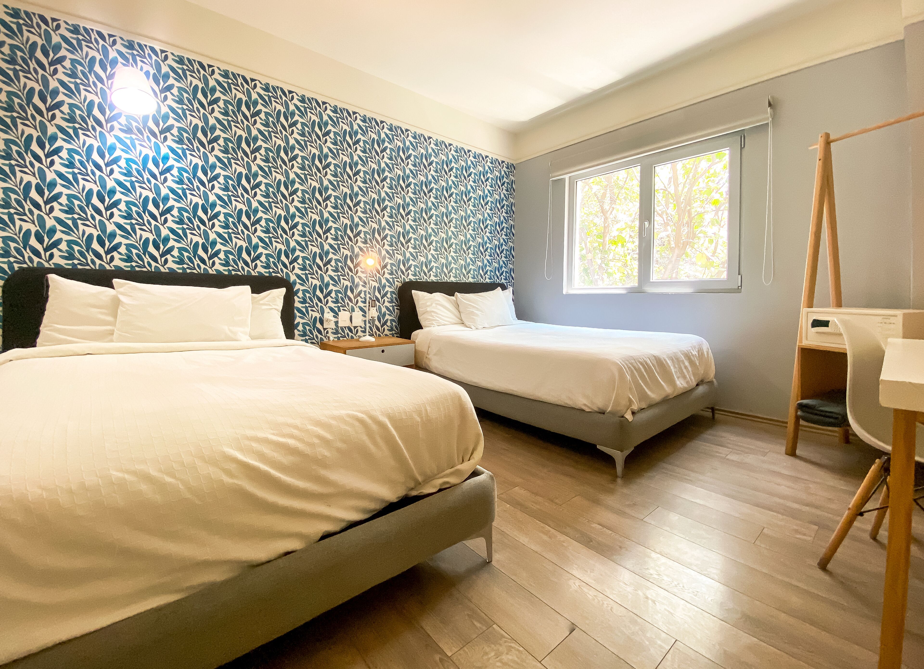 family room, 2 double beds, city view | premium bedding, down duvets, select comfort beds, in-room safe