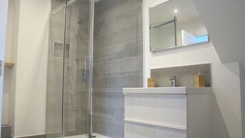 Bathtub, hair dryer, towels, soap