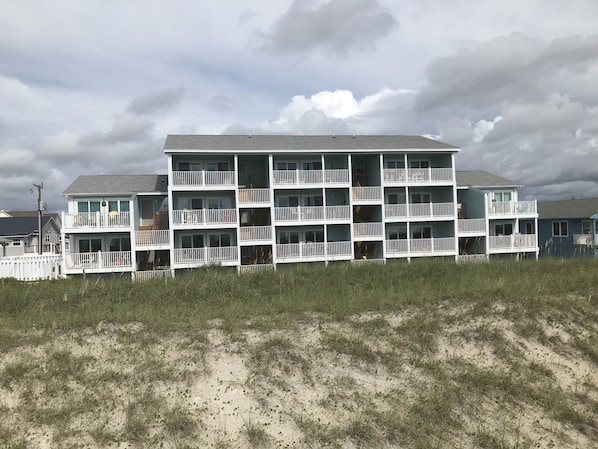 Enjoy stunning views of the surrounding landscape from the balconies of this coastal residence.