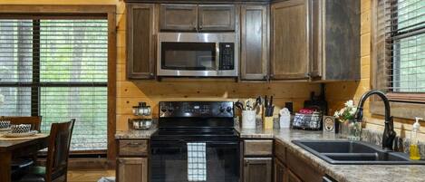Coffee/tea maker, fridge, microwave, oven