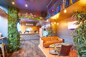 A reception area with a reception desk, a sofa, and a coffee table.