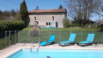 Rear view of the cottage and pool