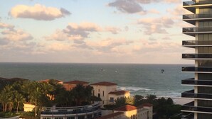 A coastal view with a modern building and a beachfront property. - Beautifully modern just renovated steps away from the Beach. (Miami Beach)