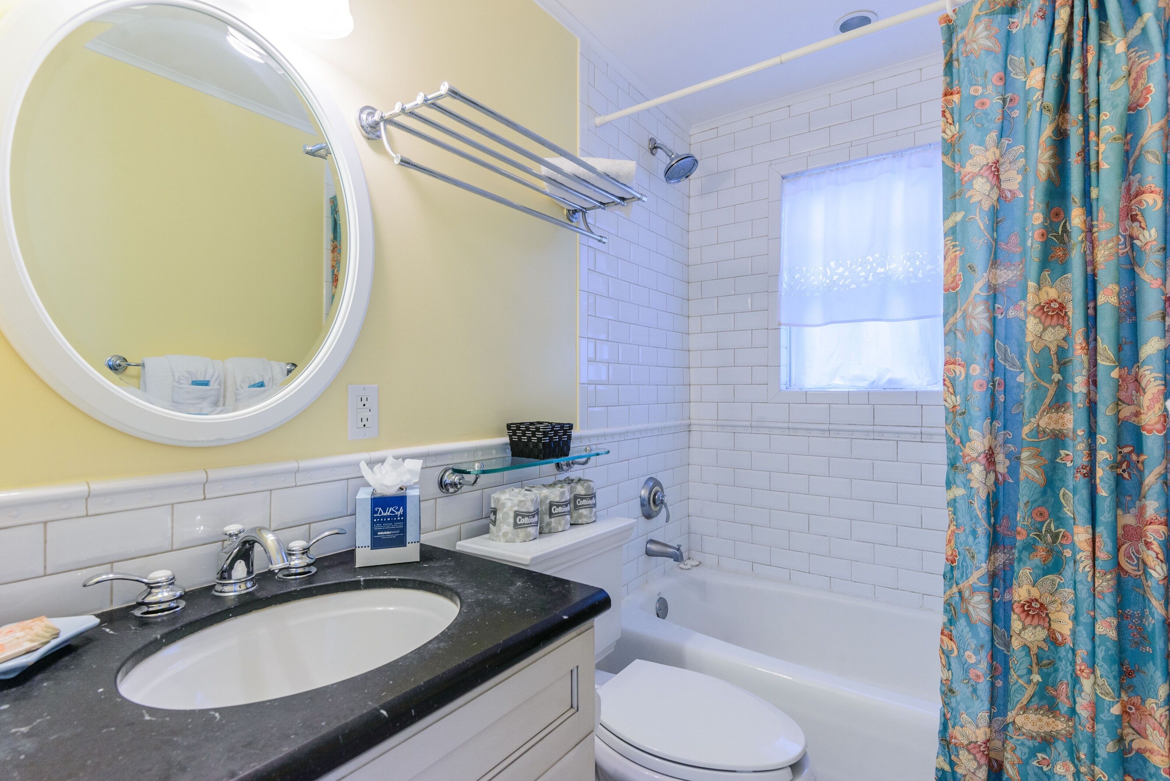 A bathroom with a sink, toilet, and bathtub.