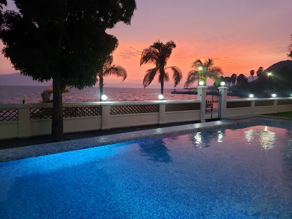 Outdoor pool, open 9:00 AM to 8:00 PM, pool umbrellas, pool loungers