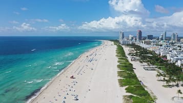 On the beach, white sand, beach towels