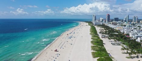 On the beach, white sand, beach towels
