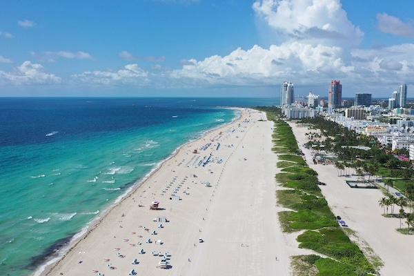 On the beach, white sand, beach towels