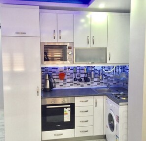 Luxury Apartment, 1 Bedroom | Private kitchen | Full-sized fridge, microwave, stovetop, cookware/dishes/utensils - Sevgi Apart (Istanbul)