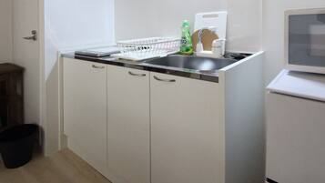 Apartment | Private kitchenette | Fridge, microwave, stovetop, dishwasher