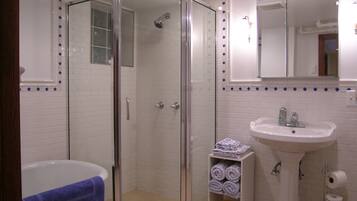 Bathtub, hair dryer, towels, soap