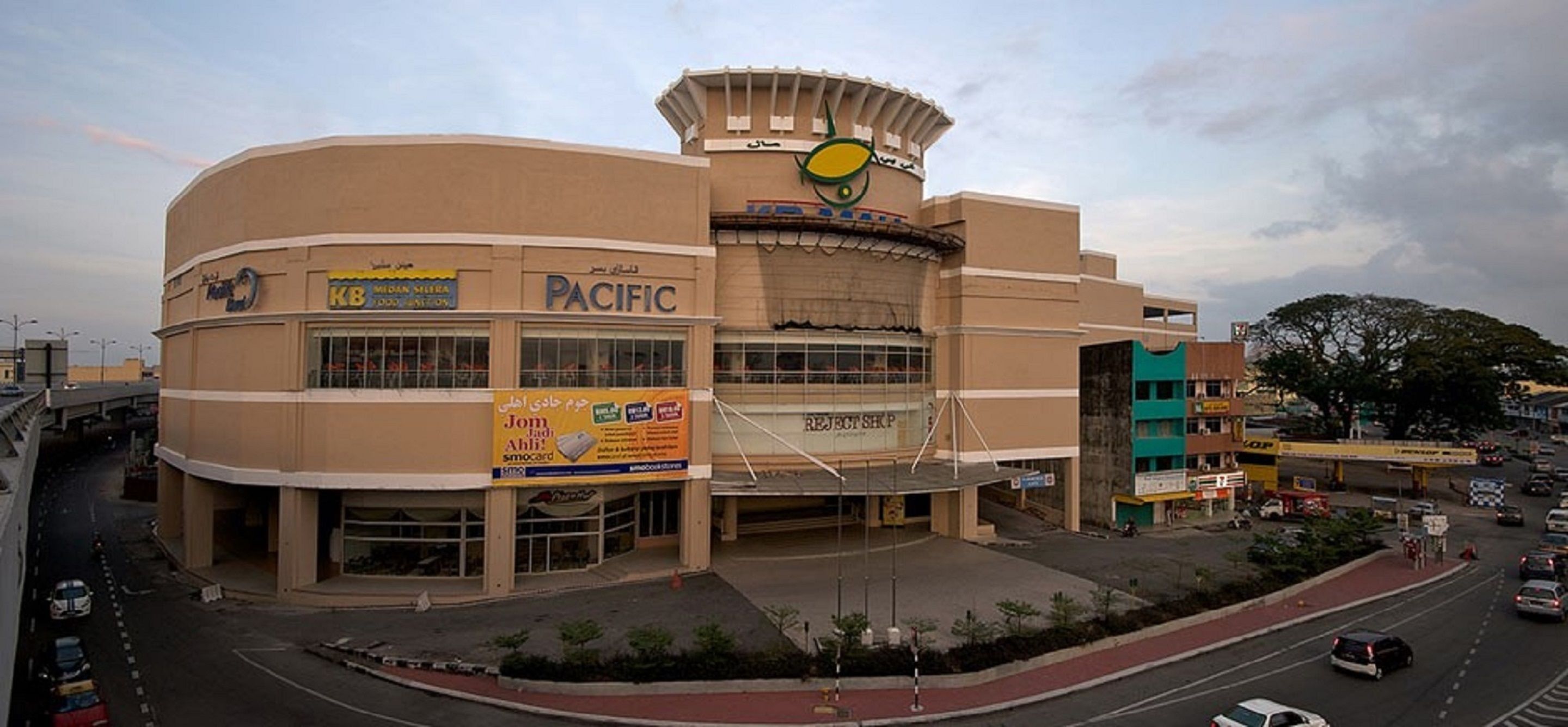 A multi-story shopping mall with a prominent 'Pacific' sign.