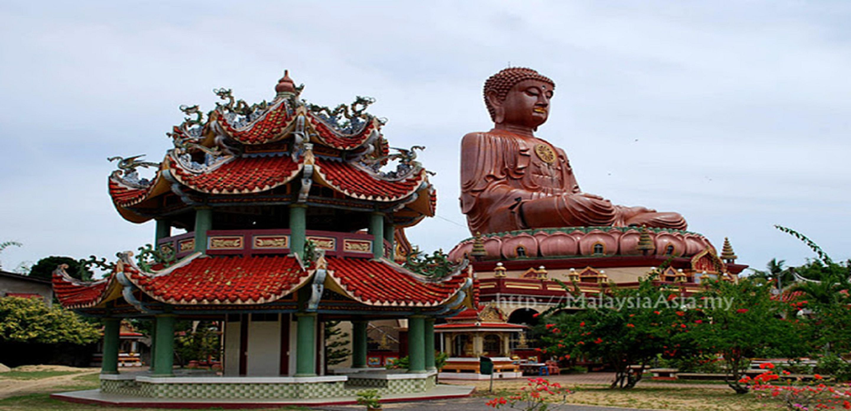 A large Buddha statue and a traditional Chinese pavilion.