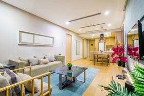 Departamento, 1 cama King size | Sala de estar | Televisión de pantalla plana y Netflix 