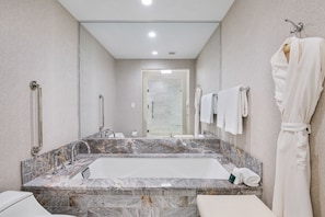 Bathtub, hair dryer, towels, soap