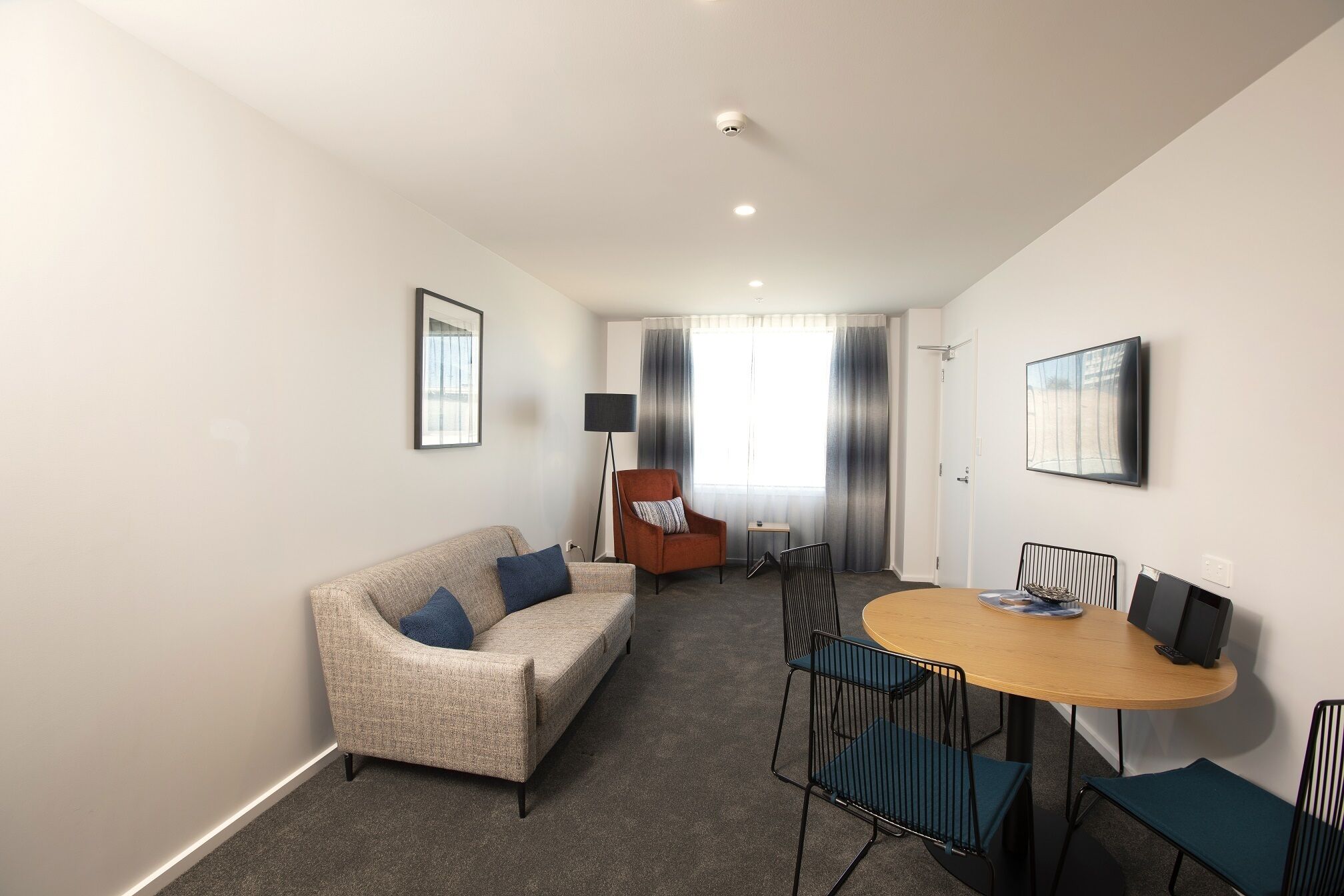 one bedroom apartment | living area | flat-screen tv, ipod dock