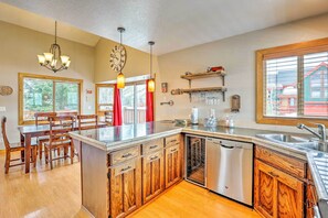 Enjoy cooking in this well-equipped kitchen with a central island, dishwasher, and ample dining space.