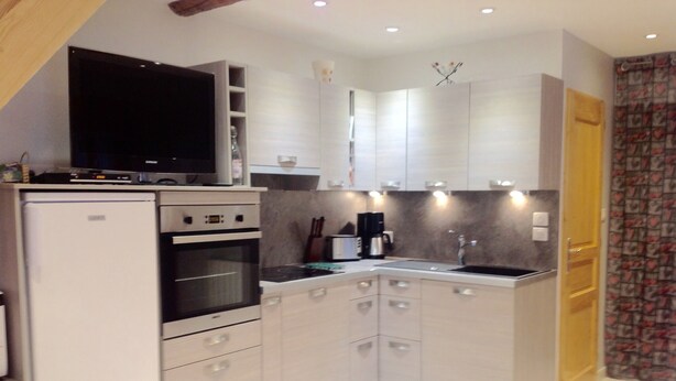 A compact kitchen with a built-in oven, a microwave, and a coffee maker. - APPT. T 3 IN CHALET (Saint-Sorlin-d'Arves)