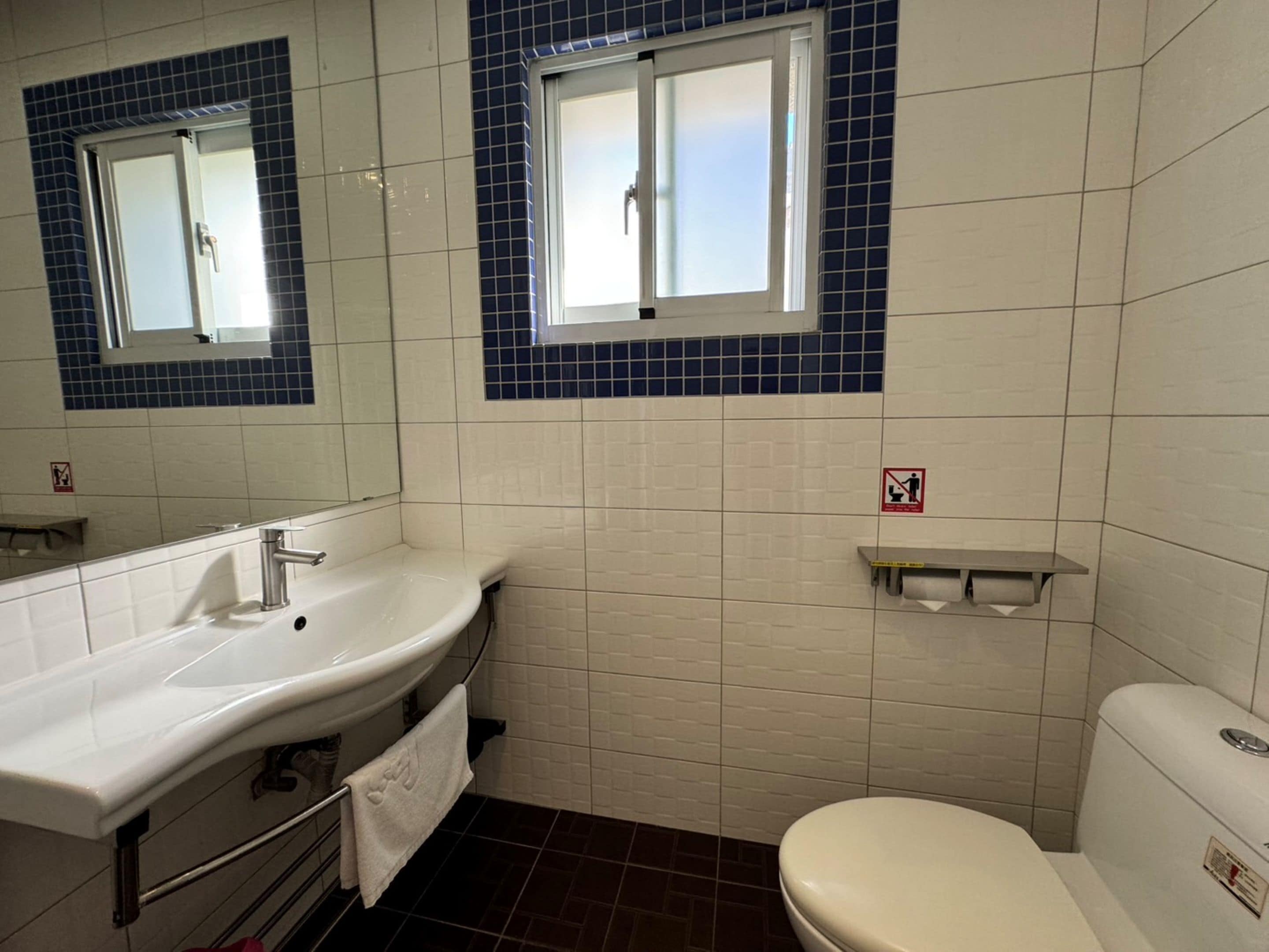 shower, hair dryer, slippers, towels