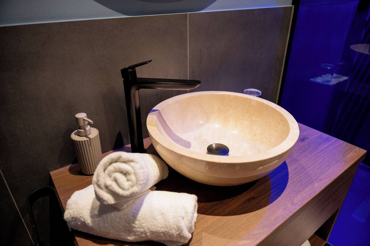 superior double room | bathroom | shower, slippers, towels