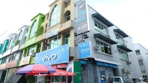 A multi-story building with a 'Vivo' sign, indicating a Vivo store. - Stada Hotel (Kota Bharu)