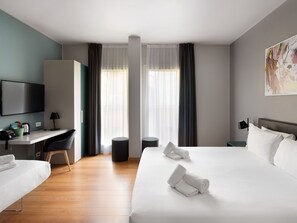 Premium bedding, down comforters, pillowtop beds, in-room safe