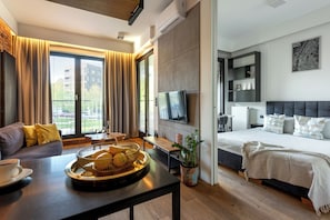 Elite Apartment, Air conditioning, Courtyard View | Living area | LED TV