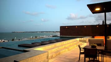 Outdoor pool, open 7:00 AM to 10:00 PM, pool umbrellas, pool loungers