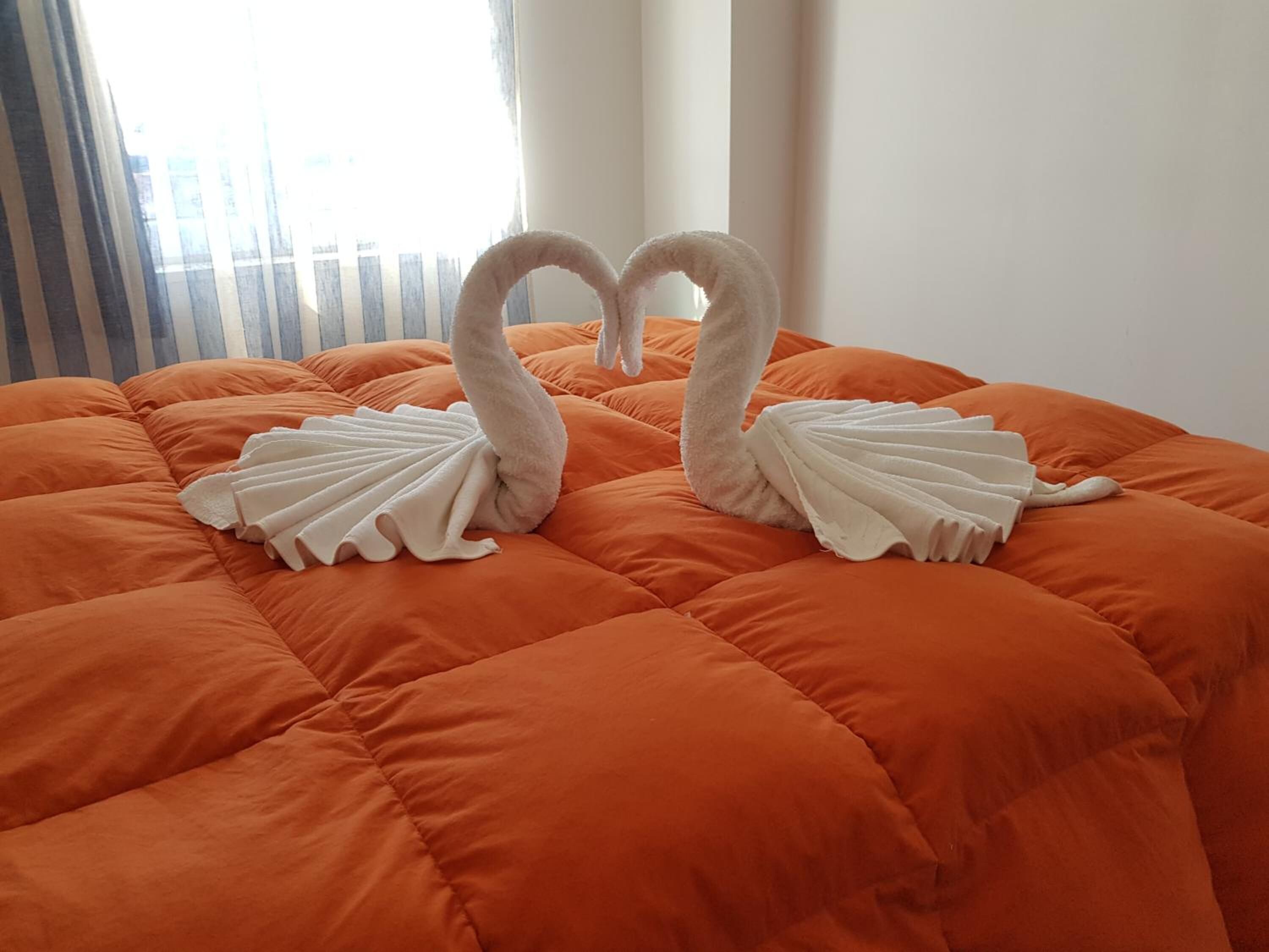 2 bedrooms, down comforters, desk, soundproofing