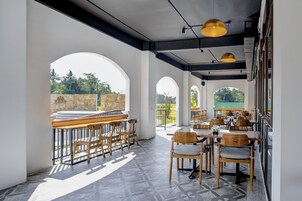 Breakfast, lunch, dinner served; Asian cuisine, pool views 