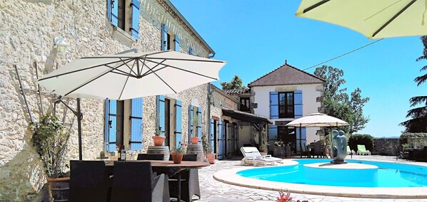 Outdoor pool, open 10:00 AM to 8:00 PM, pool umbrellas, pool loungers