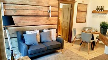 Apartment, 2 Bedrooms, Ground Floor | Living area | Flat-screen TV