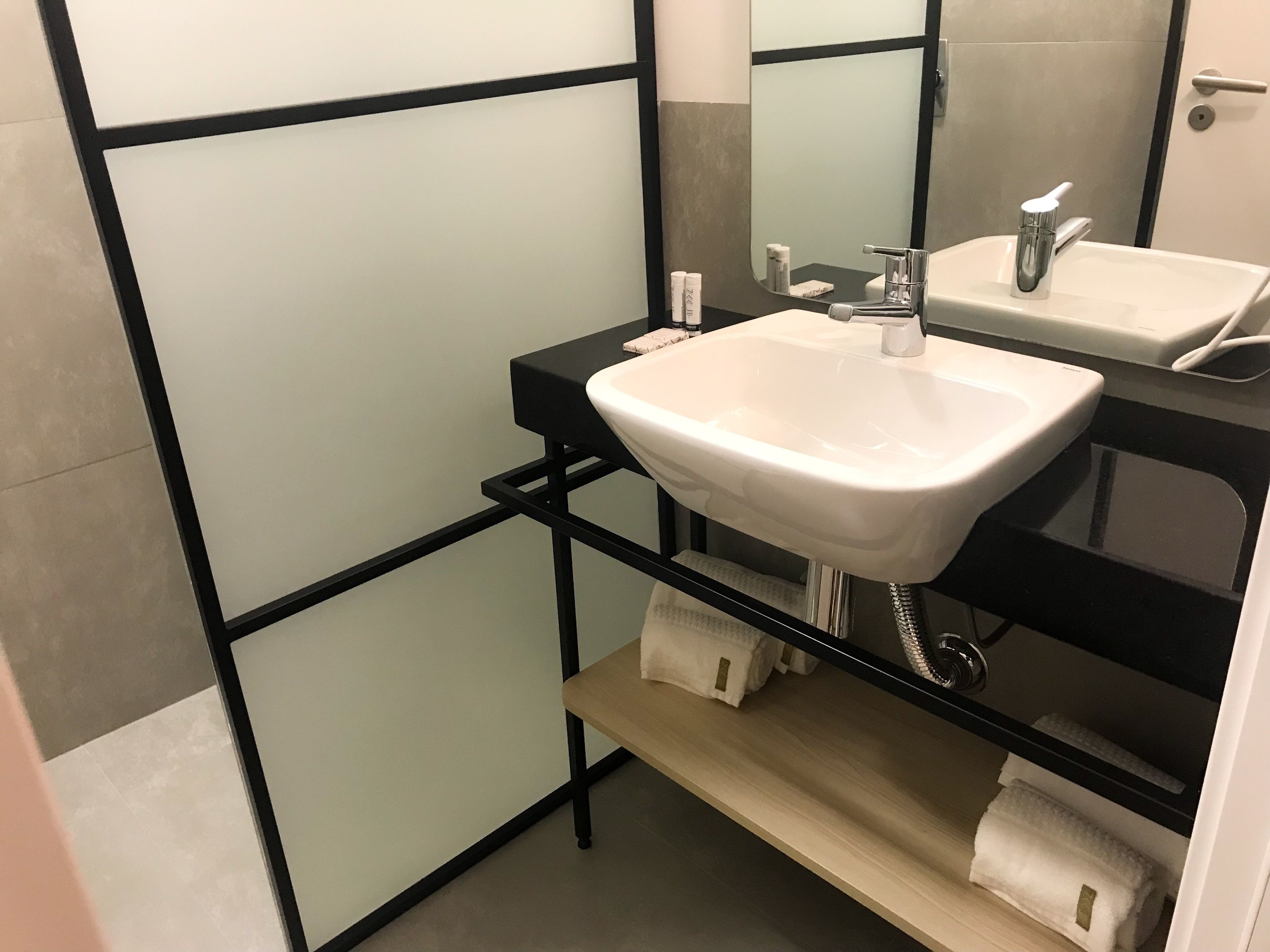 shower, designer toiletries, hair dryer, towels