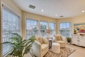 A living room with two sofas, a coffee table, a lamp, and a painting on the wall. - The Myllet at Ships Watch in Duck (Duck)