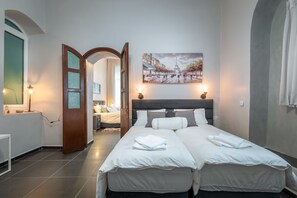 Departamento Deluxe, varias camas | 2 habitaciones, tabla de planchar con plancha y cunas gratuitas 