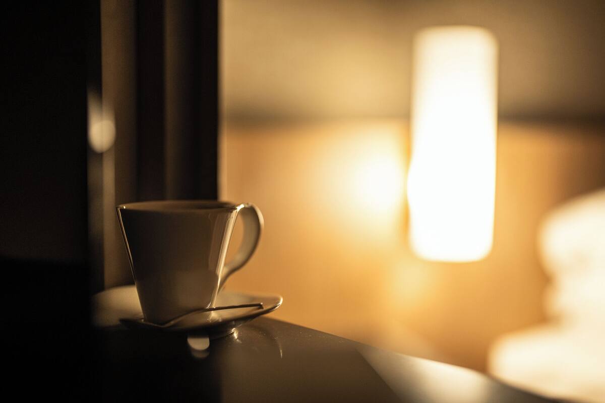A cup on a table with a blurred background.
