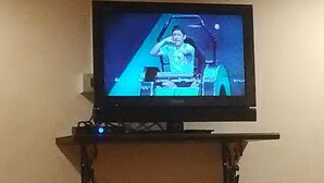 A television mounted on a wall.