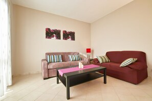Basic Apartment, 2 Bedrooms | Living area | Flat-screen TV - Appartamento Laura (Manerba del Garda)